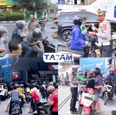 Satlantas Polrestabes Medan Bagikan Air Mineral Kepada Pengantri BBM di SPBU Pertamina 142011166 Singapore Station 2 - www.tajamnews.co.id